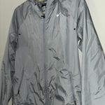Nike grey and silver windbreaker Photo 1