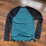 Title Nine  Rash Guard Side Scrunch Tie Black and Blue Two Sided Geometric Shapes Photo 5