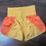 Free People movement the way home orange yellow shorts Photo 0