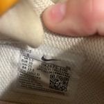 Nike Pink orange and yellow shoes Photo 1