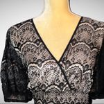 Style & Co . Flirty short black lace dress with full nude lining Photo 2