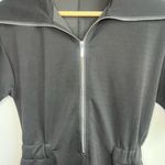 Ostaug Romper Woman’s size M Black Short Sleeve Zip Photo 2