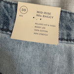 Universal Threads Women's Mid-Rise 90's Baggy Denim Jeans - Universal Thread™ Size 30 (4-5X) NWT The Women's Mid-Rise 90's Baggy Denim Jeans by Universal Thread in size 30 (4-5X) offers a comfortable and stylish fit for plus-size women. These straight-leg jeans in a classic blue denim color are perfect for those looking for a retro-inspired look with a modern twist. The baggy fit and mid-rise waist give a relaxed and effortless feel, while the denim fabric ensures durability and timeless style. Perfect for achieving that classic 90's vibe in any outfit. Photo 7