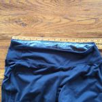 Tangerine 🌸3 for $20🌸 Leggings with venting mesh, color stripe and zipper pocket s… Photo 3