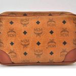 MCM  Brown Clutch with Logo Pattern and Wrist Strap Photo 1
