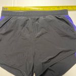 Under Armour Women  Heat Gear Black Purple 2 in 1 Shorts Pockets Drawstring Sz S Photo 5