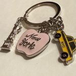 design USA Keychain - new - New York - dainty - pink apple, yellow taxi cab, silver statue of liberty. Enamel on metal. Charms are approx 1" each - see pics for measurements. Brand is . Photo 1