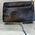 Crossbody dark blue with a Z emblem on the front but no markings on the bag.​​​ Photo 1