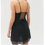 Urban Outfitters  black mini dress with lace-up back detail Photo 1