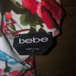 Bebe size 4 of the shoulders floral dress with flair sleeves. Photo 1