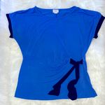 Jaclyn Smith  Blue and Black Top With a Tie Up Bow On The Side Photo 0