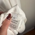 Size medium flowy white dress with runching in the back and puffy sleeves Photo 4