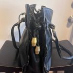 A.P.C.Elegant Black Leather Tote Bag With Brass Accents. Photo 1