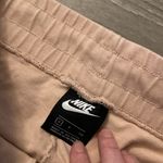 Nike  cream pinkish hue cropped sweat pants size small Photo 3