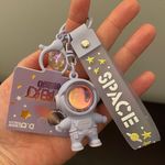 Cute cartoon Astronaut with the sunset light keychain Purple Photo 2