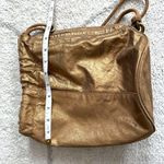 DKNY Vintage  Metallic Gold Leather Backpack Purse Drawstring Shoulder Bag Photo 3