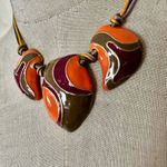 Orange green and burgundy enamel swirl statement necklace Photo 1