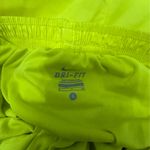 Nike  Women's Vibrant Yellow and Pink Athletic Shorts are a size small. Photo 5