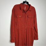 Free People rust colored eyelet jumpsuit zip up size 4β Photo 2