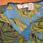 Kathy Ireland  green roses flowers and blue blouse with‎ pin Photo 1