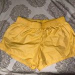 Nike Women’s  yellow parachute shorts  Photo 0