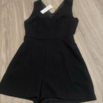 BCBGeneration  Elegant Black V-Neck Romper Photo 0
