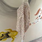 Main Strip  oversize sweater.  Off the shoulder.  Size Small. Twist back. Photo 1