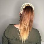 Boutique Criss Cross Ponytail Hat featuring a camo print and a Mom Heart Trucker Band. Photo 5