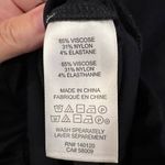 Stella & Dot  black long sleeved top with ruffle detail at hips size medium Photo 5