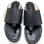 Calvin Klein "BEHATI" BLACK PEBBLED LEATHER W/GOLD SIGNATURE PLATE SANDALS (6) Photo 11