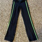 Lululemon Athletics Crops Black Leggings with green stripe Size 2 excellent cond Photo 0