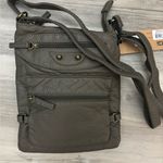 Jassy Chocolate Brown crossbody bag with lots of pockets and a zipper closure Photo 0