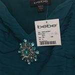 Bebe silk teal dressy top with jeweled broach Photo 4