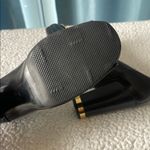 Tory Burch Black and Gold Chunky Heel Pumps with Gold Ornament Photo 4