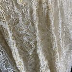 Free People -DONT YOU DARE Stunning cream color lace dress, sleeveless, lined, front keyhole opening, V back, skirt has some gold shimmer, excellent condition, size XS Measurements: Bust: armpit to armpit 15 inches Length: shoulder seam to bottom 33 inches Photo 9