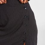 Volcom NWOT- So cute pencil skirt, black with small polka dots, front off side buttons with slit, back waistband is elastic, excellent condition, never been worn, size medium (8) Photo 4