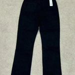 We Wore What NWT  high rise black button front crossover straight leg jeans Photo 2