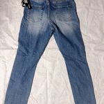 Articles of Society ® HIGH RISE • STRAIGHT super soft size 27 jeans new with tag Smoke and pets free Same day shipping This pair of jeans from is a high-rise, straight style in a beautiful blue color. It features a zip and button closure, stretch material, and pockets for convenience. The size is 27 and it is brand new with tags. Perfect for any woman looking for a stylish and comfortable addition to their wardrobe. Photo 3