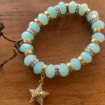 Juicy Couture  Stretch Blue/Teal Beaded Charm Bracelet with Dangling Star Charm Photo 1