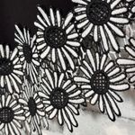 Kirkland Signature Elegant Black Floral Hem top with cold‎ shoulder embroidered flower shape cutout Photo 5