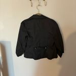 B. Wear  black striped puff sleeve blazer Photo 4