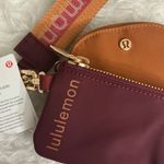 Lululemon athletica Burgundy and Tan Wristlet Photo 1