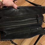 Black shoulder bag with studded accents Photo 1