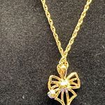 Nina Ricci gold and crystal bow necklace Photo 2