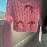Chic Light Pink Cable Knit Sweater with Ribbon Accents Photo 1