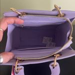 Trina Turk double handle tote in lilac with a removable crossbody strap Photo 1