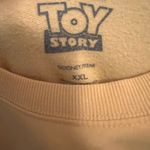 Disney  Pixar Toy Story “Sunnyside Day Care” Yellow Crewneck Sweatshirt Size XXL Photo 2
