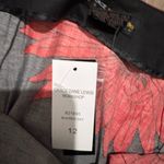 Chic Black Skirt with Red Floral Design Size 12 Photo 1