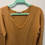We The Free  Free People Long sleeve v neck sweater with raw edges. Photo 1