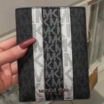 Michael Kors Black Jet Set MK Stripe Passport Wallet Photo 0